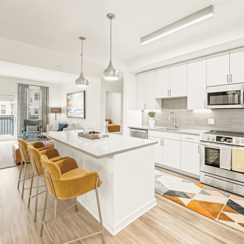 Sleek quartz countertops, stainless steel appliances, and overhead lighting. ✨ 
What's your favorite part of your Juniper kitchen? 🍽
#JuniperMerriweather #LiveMerriweather #ColumbiaApartments #ColumbiaLiving Instagram Image5